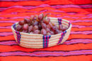 Handwoven Oval Serving Basket with Pink and Blue Accents